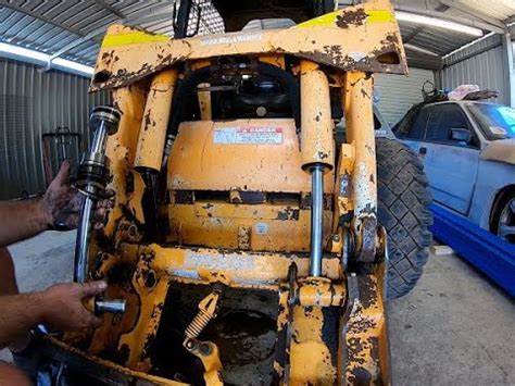 how to remove hydraulic cylinder for skid steer|skid steer hydraulic cylinder removal.